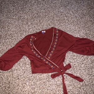 Rust colored Francesca’s surplice wrap top